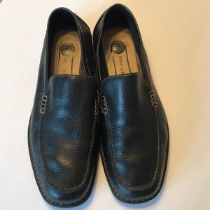 Rockport men’s black leather loafers.